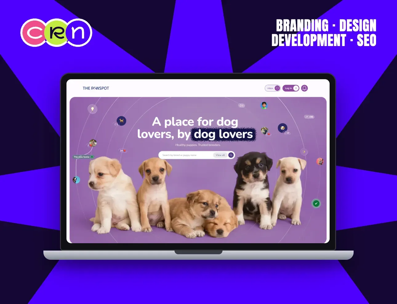 The PawSpot homepage: five puppies on a purple background under the headline “A place for dog lovers, by dog lovers”.
